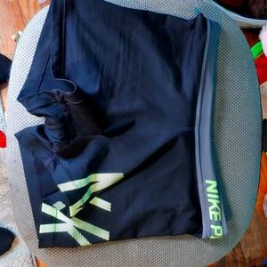 Black Nike Pro Shorts with Gray waist band and Neon Green Nike print